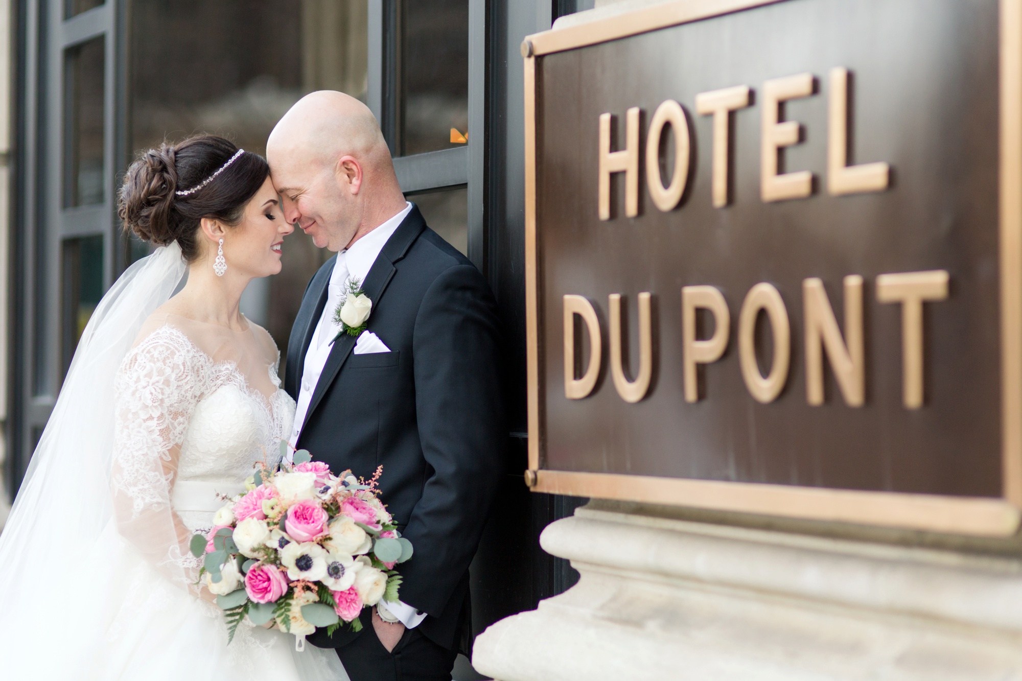 Bride and Groom at Hotel Dupont Sign